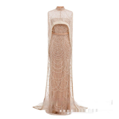 Elegant Pearl Embroidery Material Evening Party Dress with a long skirt and stylish cape in a soft skin color.
