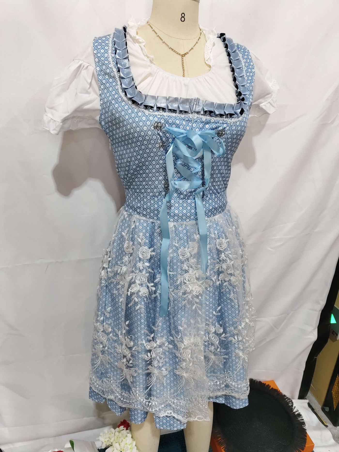 Halloween Munich Beer Long Short-sleeved Printed Lace-up Dress displayed on a mannequin with blue and white floral design.