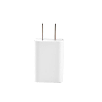 White wall charger adapter for electronic devices with two prongs.