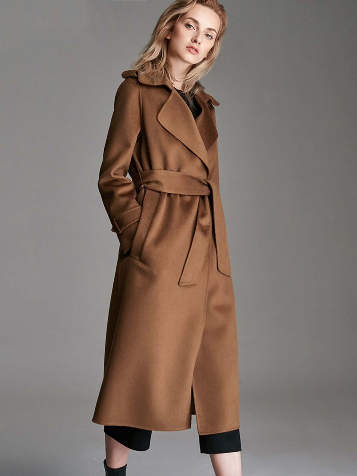 Fashionable Long Knee Length Woolen Jacket in caramel color, designed with a suit collar and lace-up pockets.