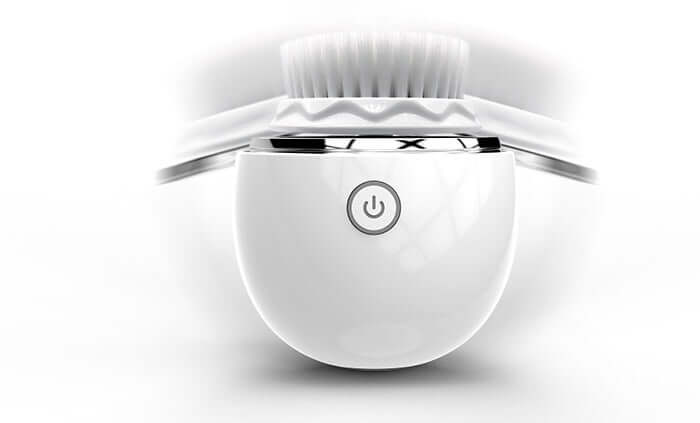 Ultrasonic electric face washer with circular brush and power button, designed for effective facial cleansing.