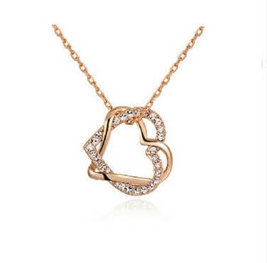 Double diamond heart necklace earring set featuring a rose gold pendant design with crystal embellishments.