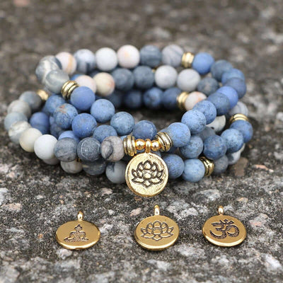 Tiger Eye Stone Bracelet Necklace 108 Buddha Beads Lotus Bracelet displayed with decorative gold charms.
