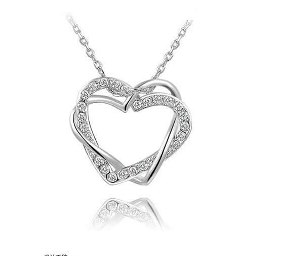 Double diamond heart necklace earring set featuring an exquisite silver heart pendant design with crystals.